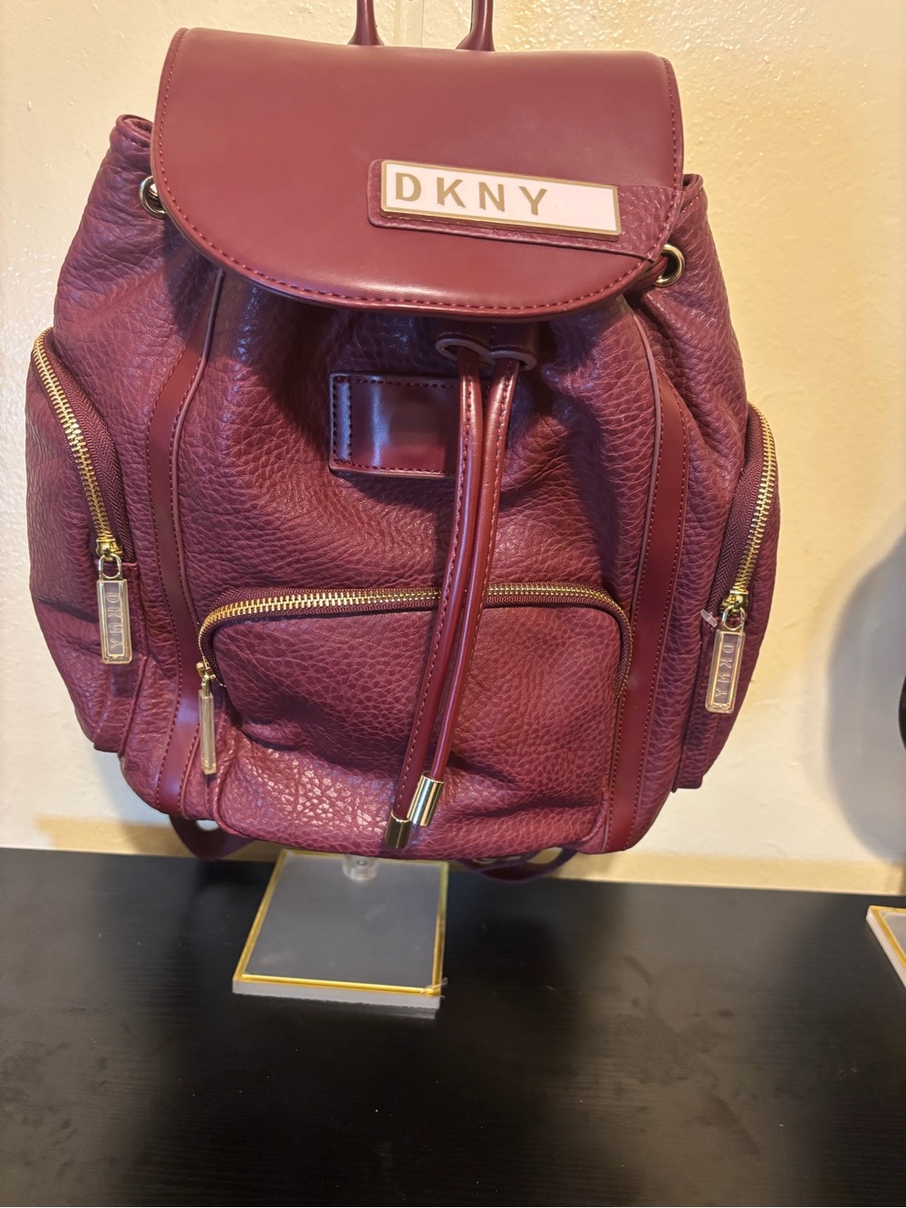 DKNY Burgundy Leather Drawstring Backpack with Gold Hardware